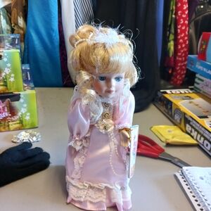 Elegant Pink Porcelain Doll